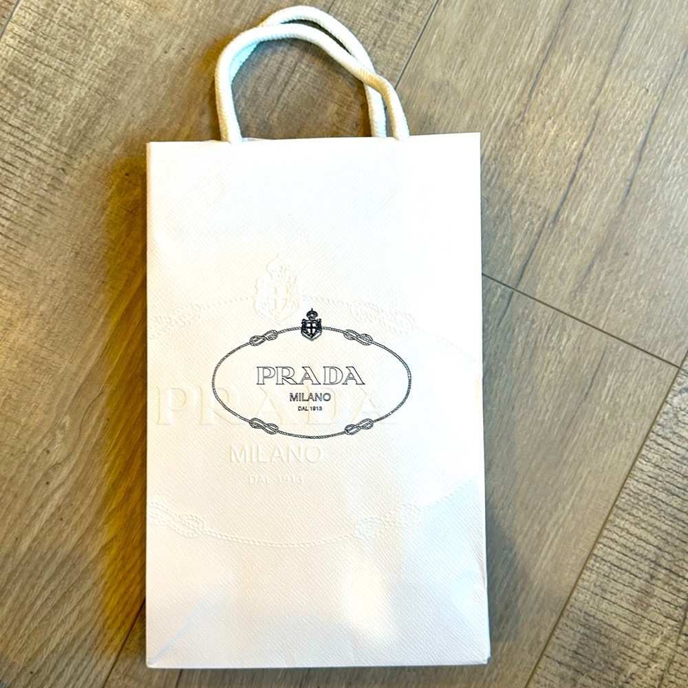 2 Prada small paper/rope shopping bags. 10” tall 6.5” wide. 2 come together